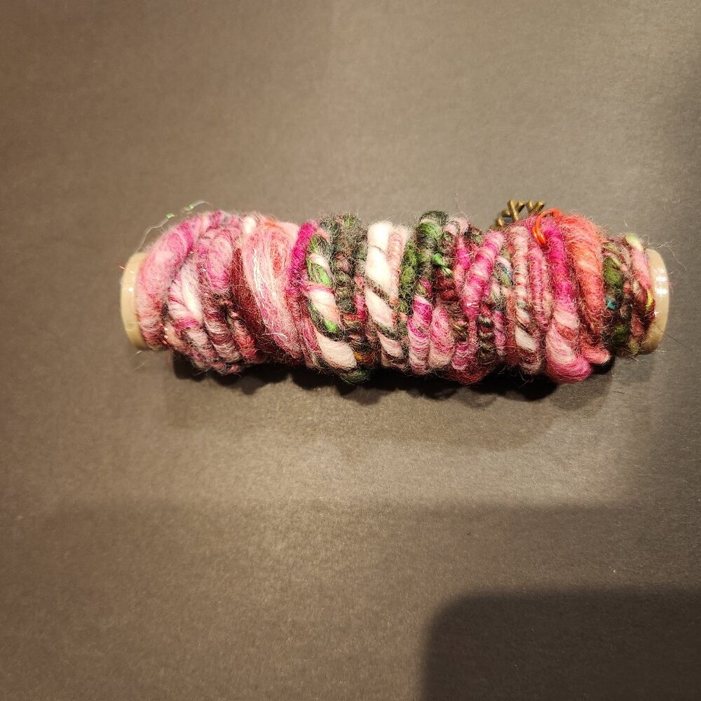 Hand spun fine wool art yarn 5 yards, new, with shiny soft fibers.